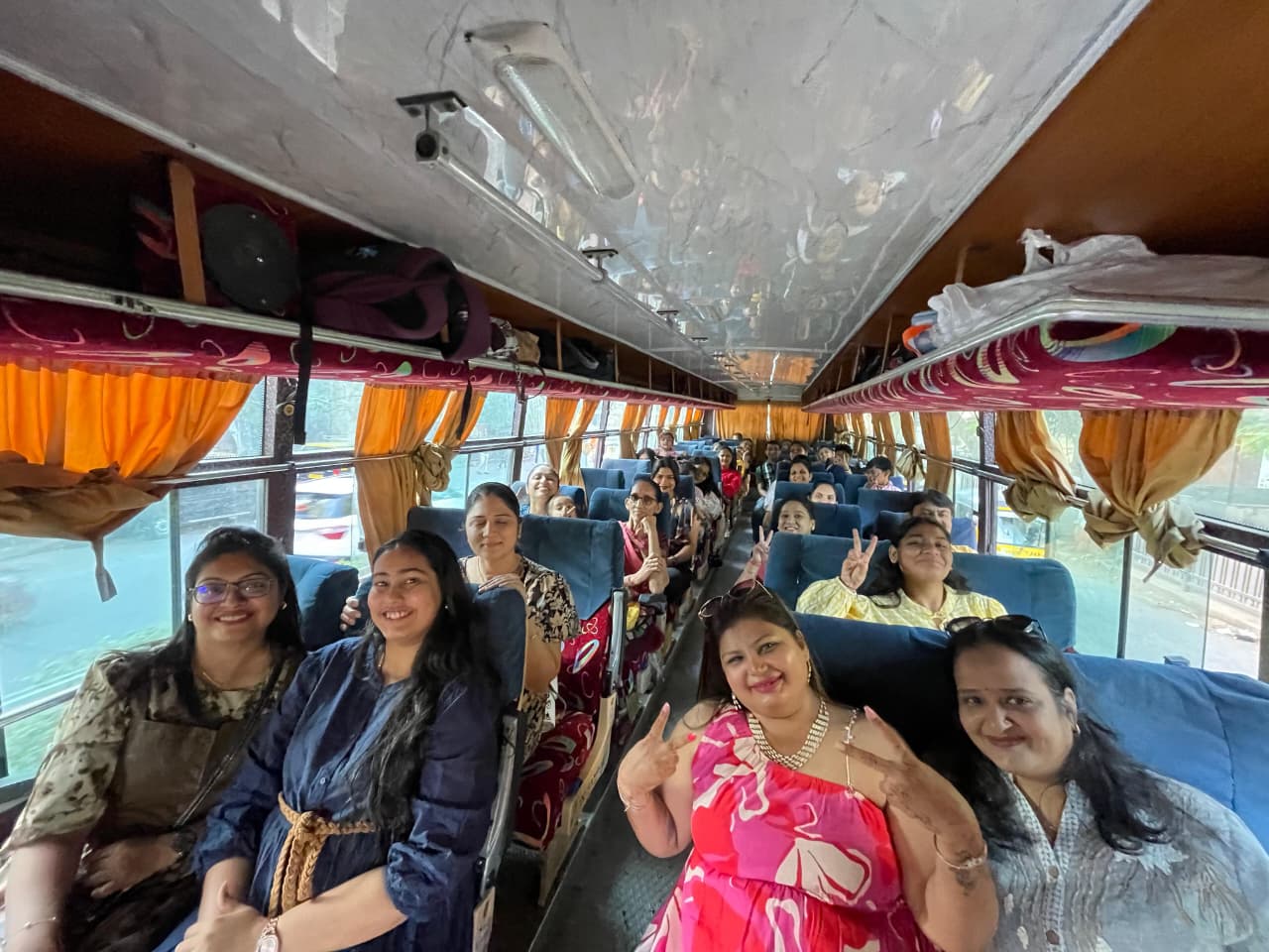Parents enjoying a bus ride on the school trip