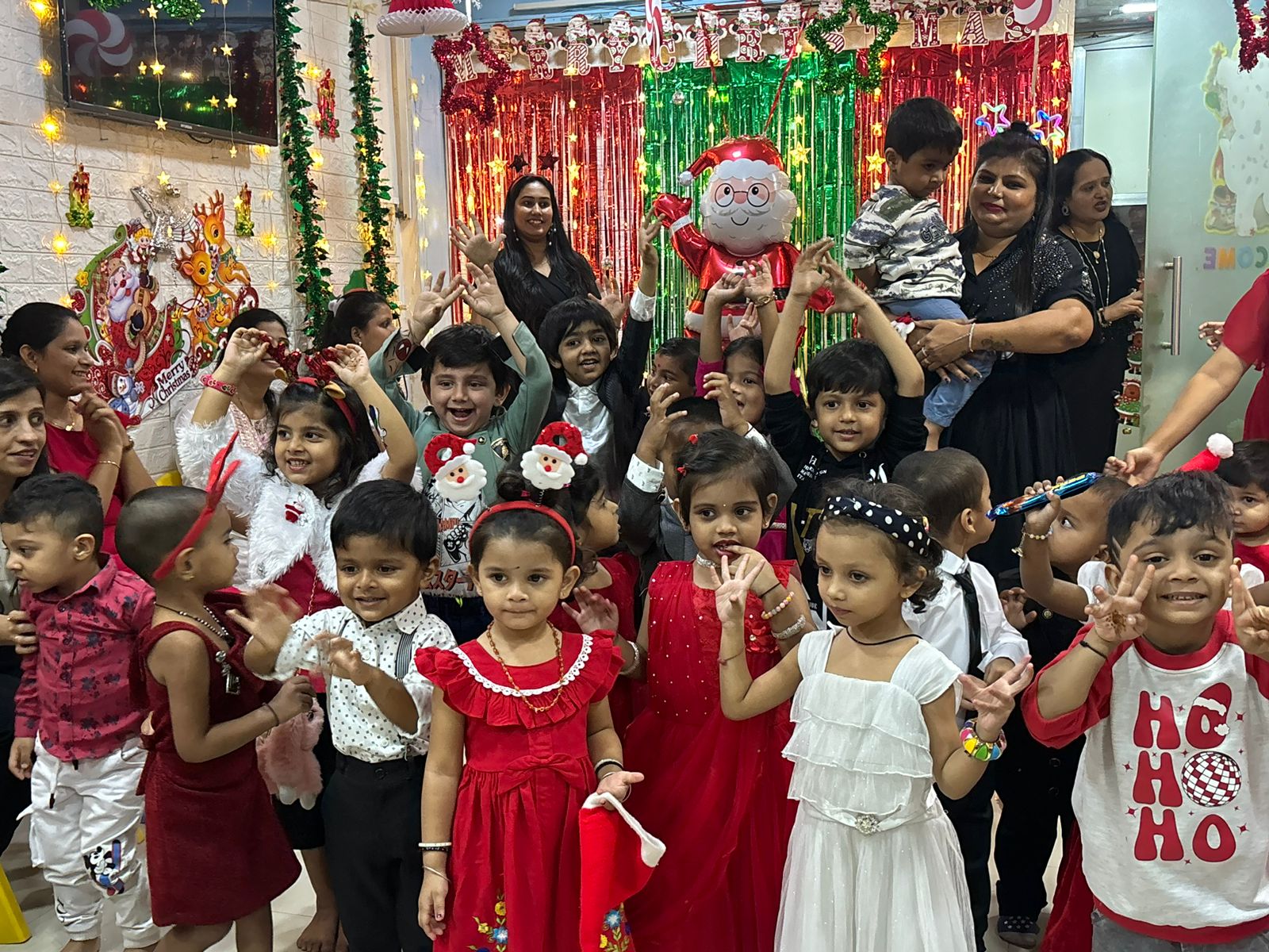 Children and teachers celebrating Christmas together at school